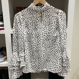 Super fun polka dot top with statement sleeve